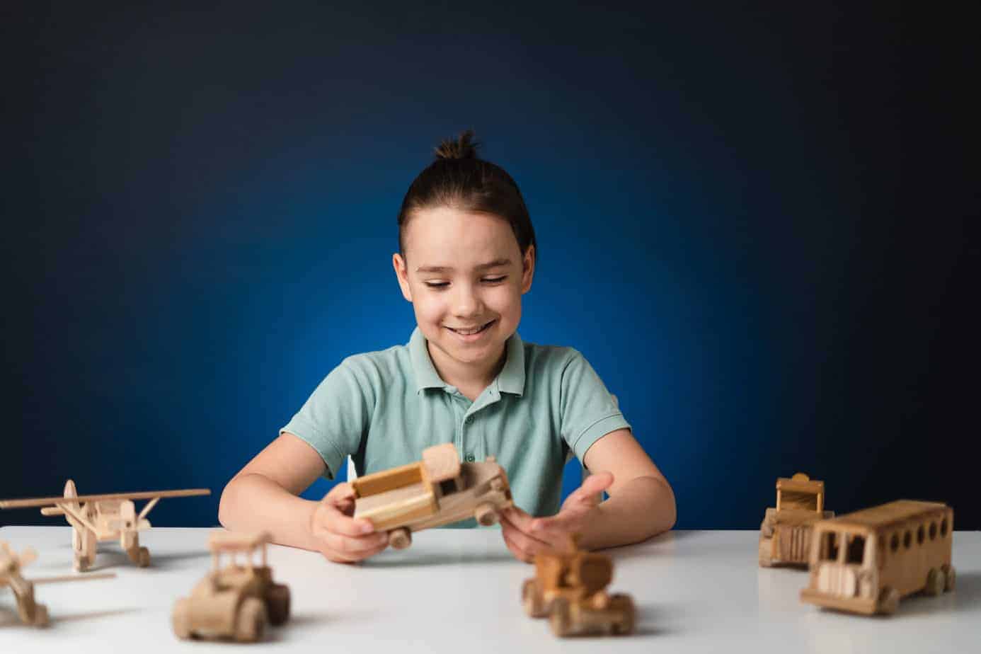 kid playing wooden toys